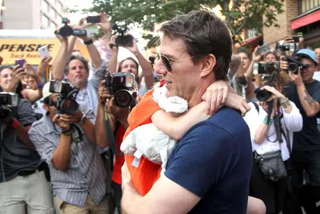 Tom Cruise carrying Suri Cruise in Tribeca yesterday  
